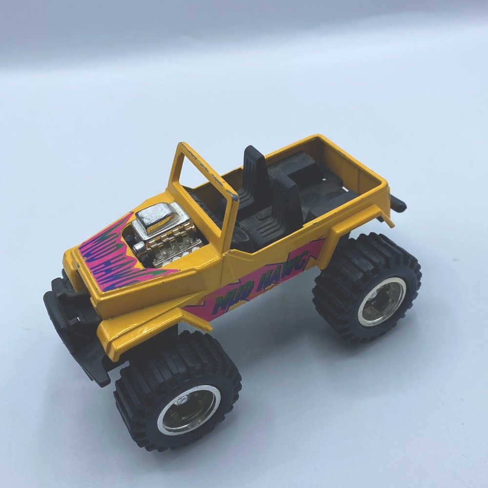 Tootsie toy Mud hawg 80s monster truck yellow 1980s toy neon truck
